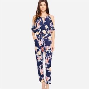 Adelyn Rae beautiful navy floral flutter sleeve jumpsuit